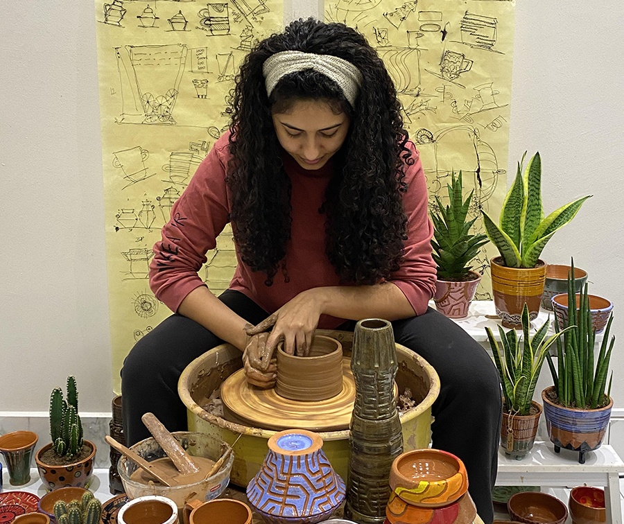 Architecture graduate provides art therapy through pottery American